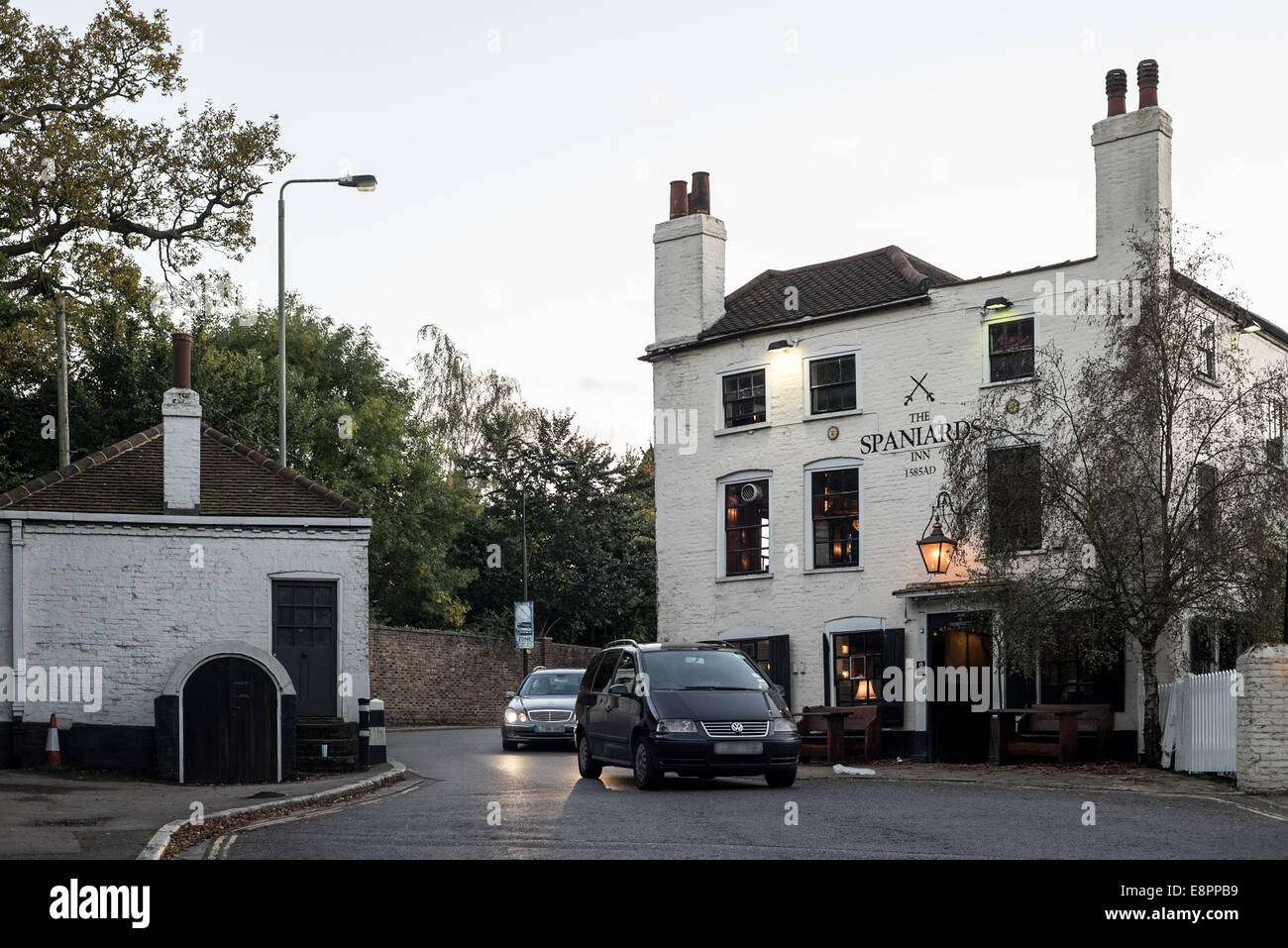 LONDON, UK - OCT 11: The Spaniards Inn on the right and the tollhouse on the left in Hampstead in London on October 11, 2014. Stock Photo