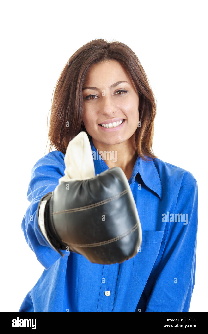 Portrait of beautiful and young business or casual woman wearing boxing gloves and showing thumbs up Stock Photo