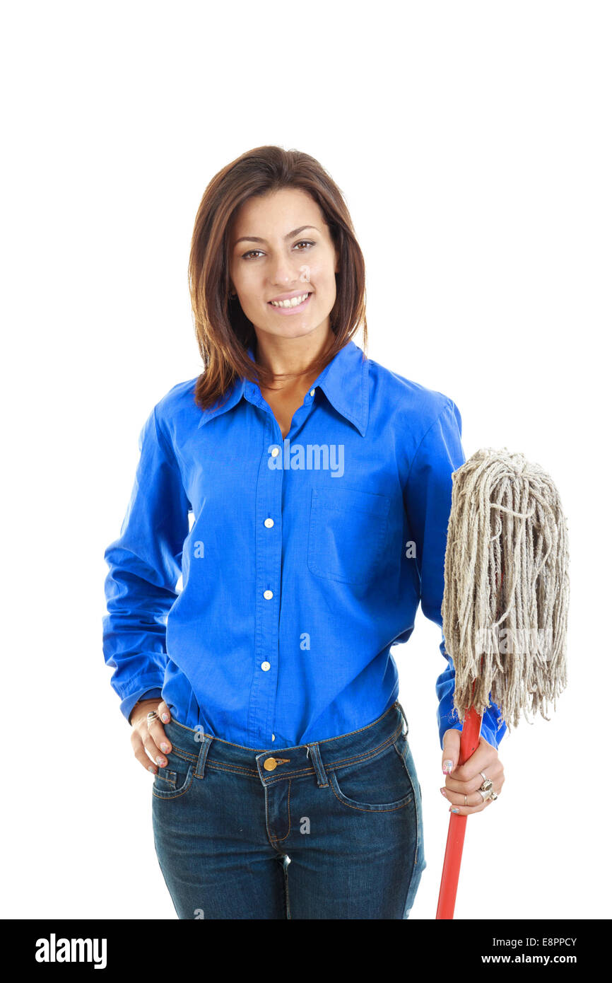 Happy young woman in jeans and blue shirt holding a mop broom ans posing  against white background Stock Photo - Alamy
