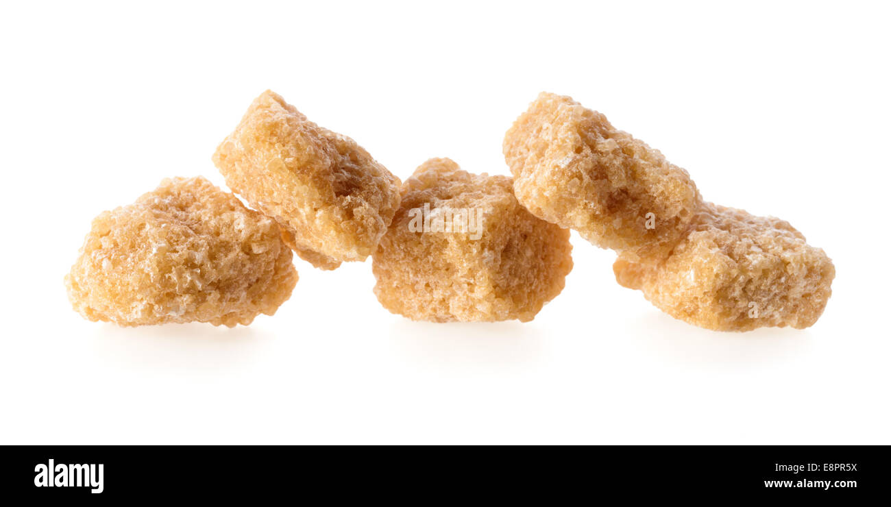 Food: group of five cane sugar pieces, isolated on white background Stock Photo