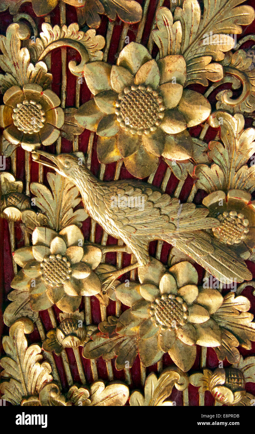 Intricate gold carved doors Balai Banjar Temple Ubud Kelod Bali Indonesia Stock Photo