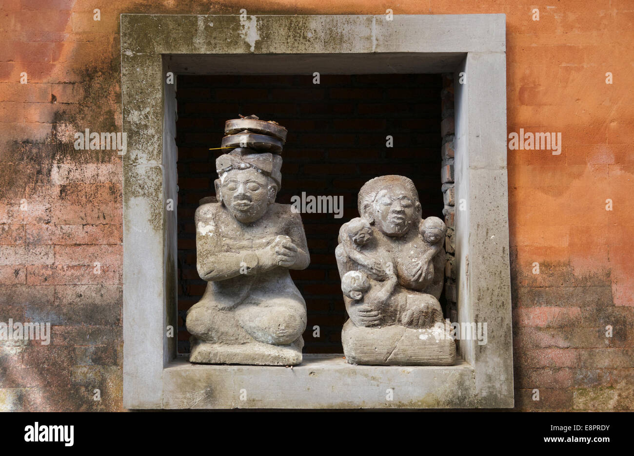 Stone sculptures Balai Banjar Temple Ubud Kelod Bali Indonesia Stock Photo