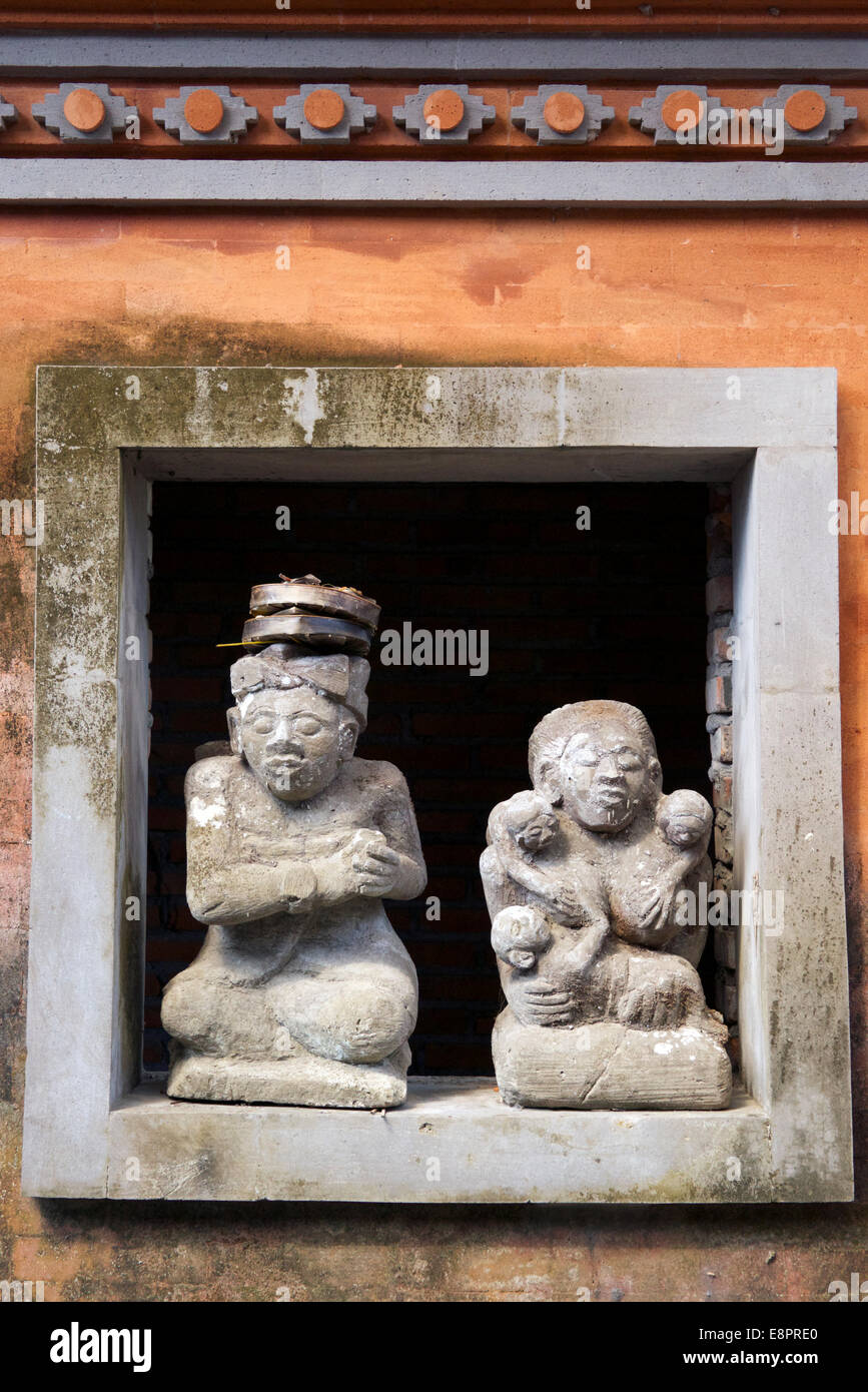 Stone sculptures Balai Banjar Temple Ubud Kelod Bali Indonesia Stock Photo
