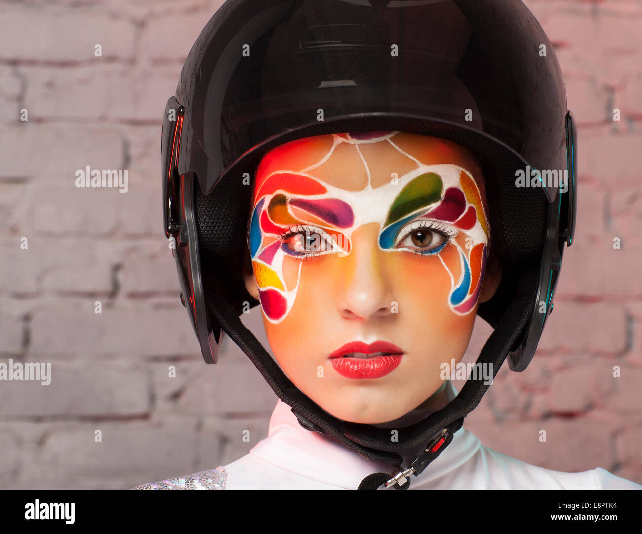 Portrait of a beautiful young model with bright creative make up with ...