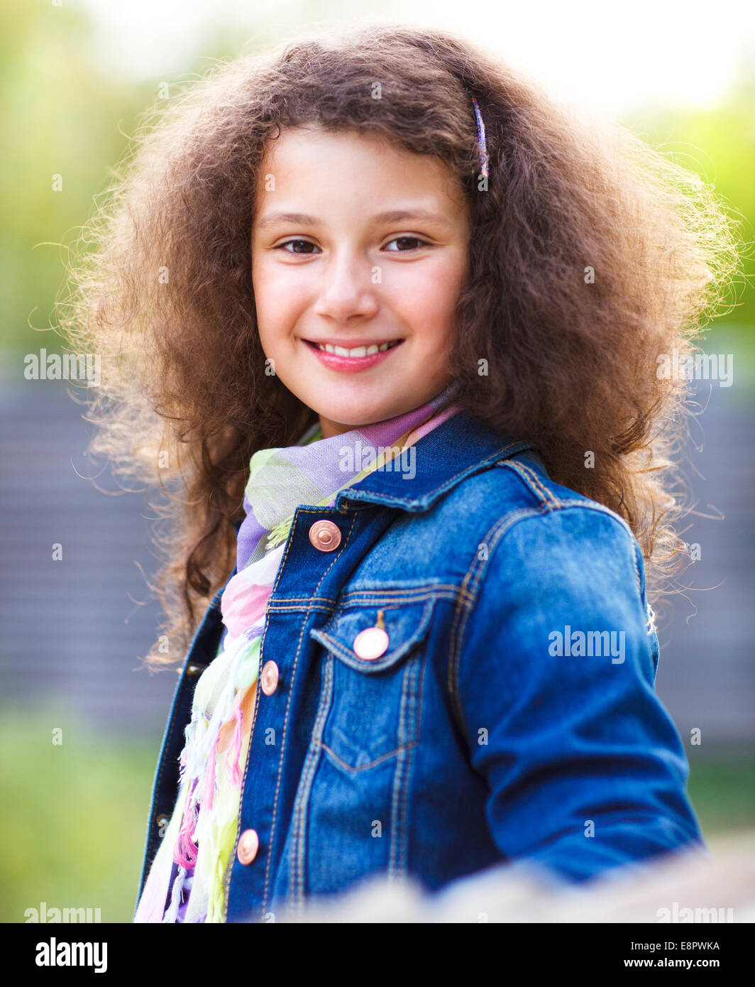 Portrait of a smiling happy little girl outdoors Stock Photo - Alamy