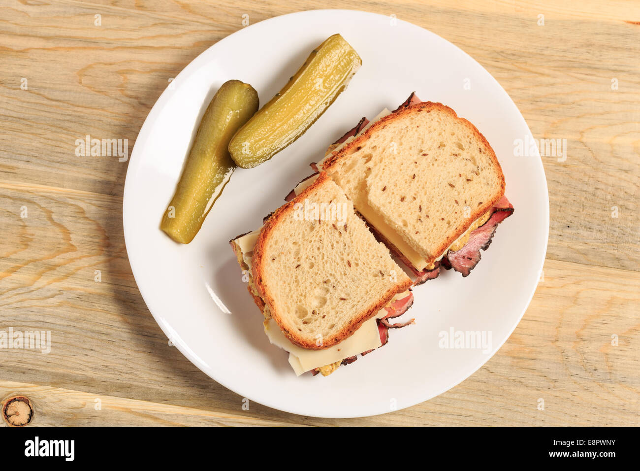 Pastrami sandwich on Jewish Rye bread with swiss cheese, mustard, and