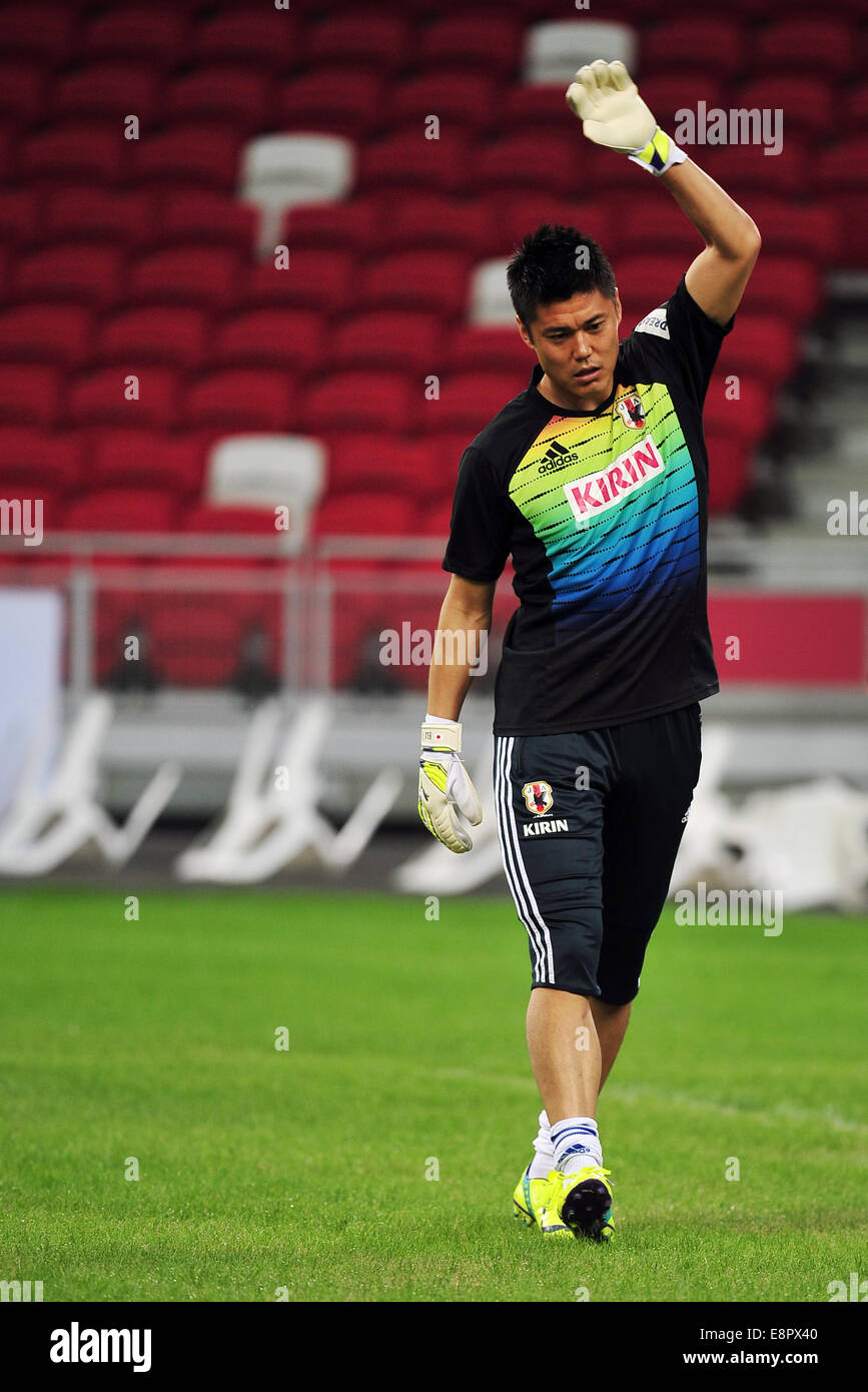 Singapore. 13th Oct, 2014. Kawashima Eiji of Japan attends a training session at Singapore's National Stadium in Singapore, Oct. 13, 2014. Japan and Brazil will have a friendly game at Singapore's National Stadium on Oct. 14. Credit:  Then Chih Wey/Xinhua/Alamy Live News Stock Photo