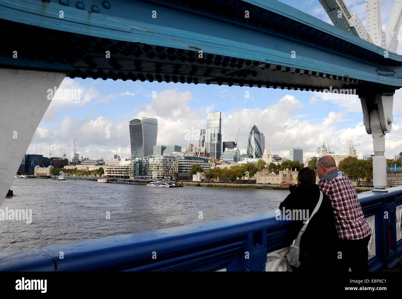 London UK October 2014 - Visitors looking out from Tower Bridger across the River Thames towards the city Stock Photo