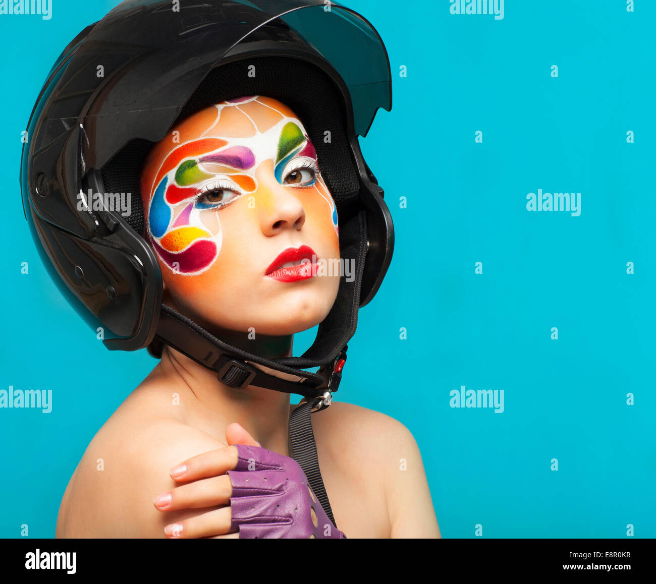 Portrait of a beautiful young model with bright creative make up with ...