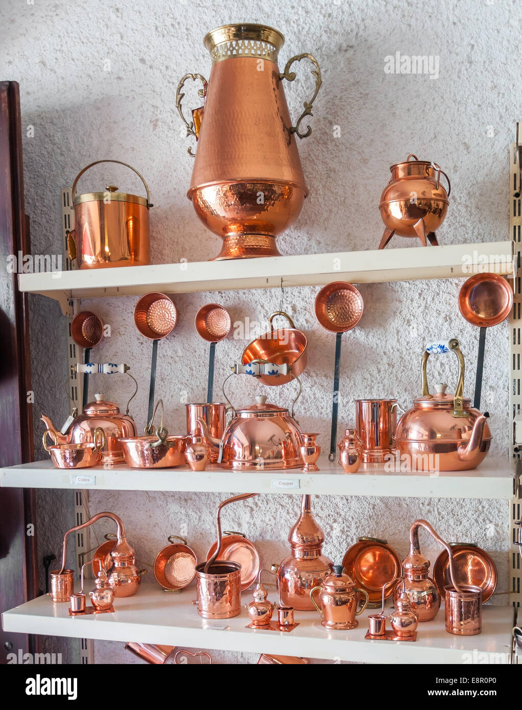Portuguese copper utensils displayed in souvenir shop Stock Photo Alamy