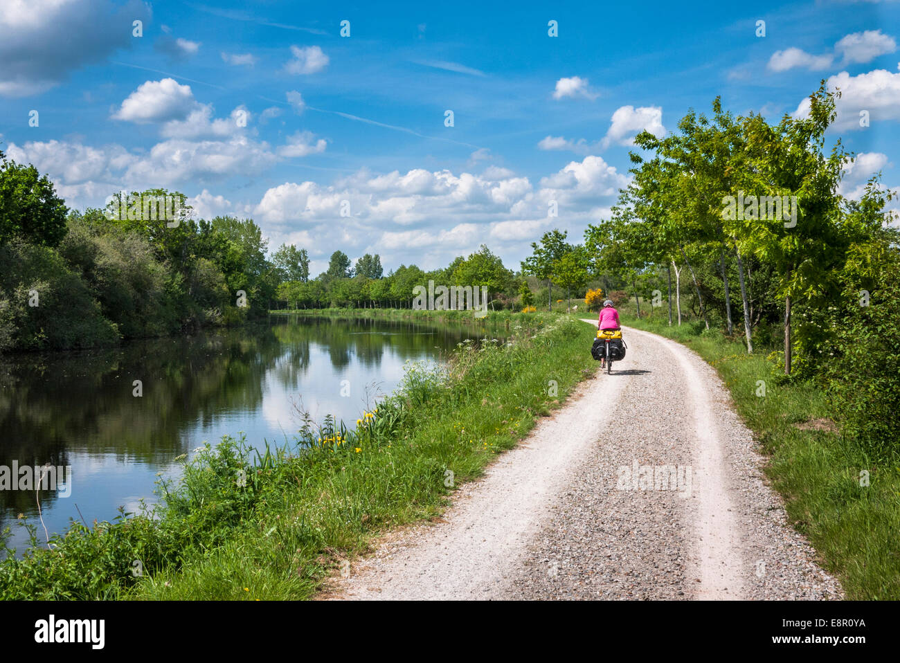 Lady cycle touring along the Nantes Brest canal Brittany France Stock Photo