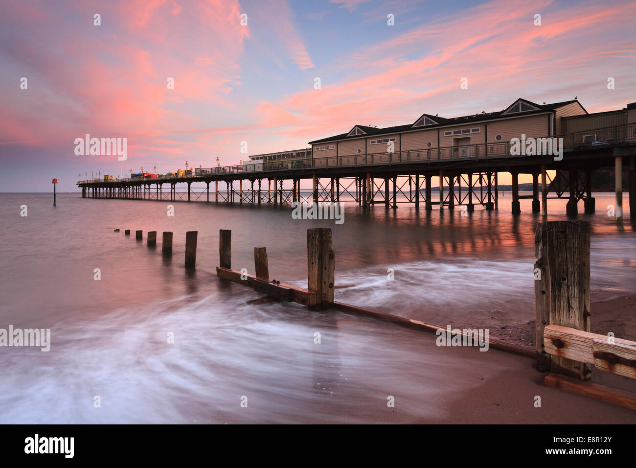 Teignmouth Pier captured at sunset. Stock Photo