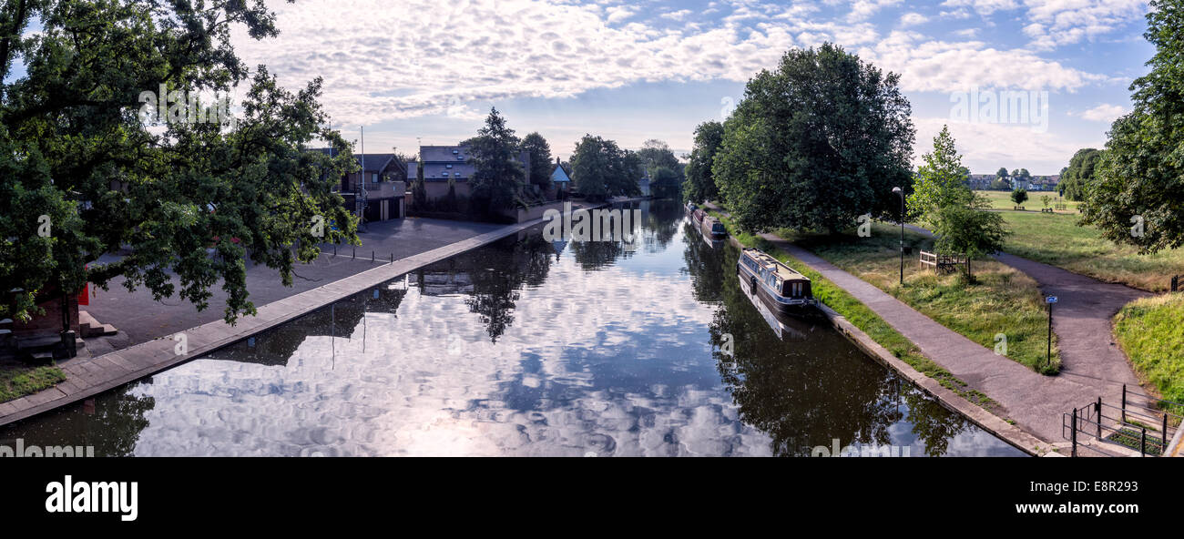 Narrow boat barge under the green trees in Cambridge, UK Stock Photo