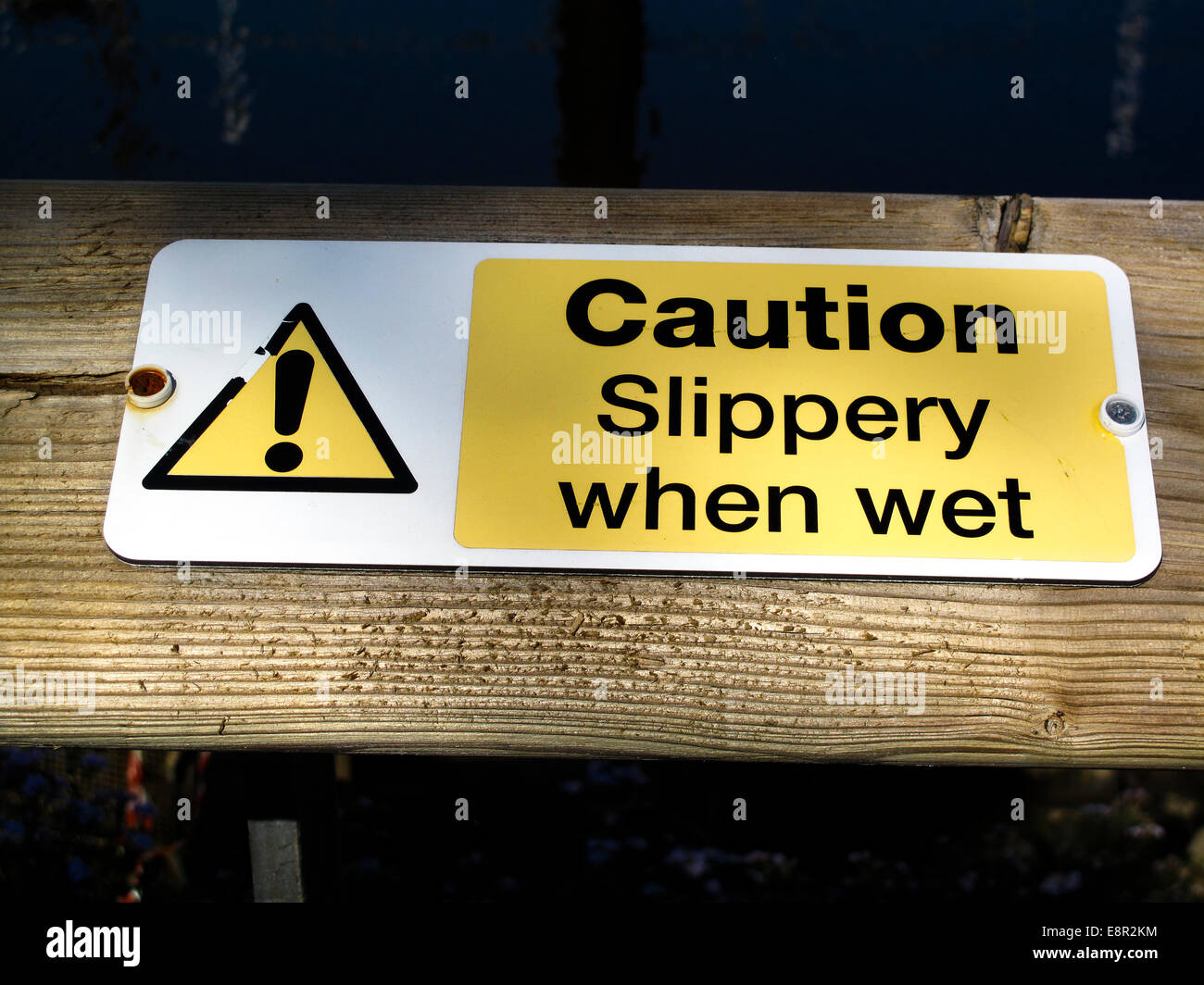 Caution slippery when wet sign Stock Photo Alamy