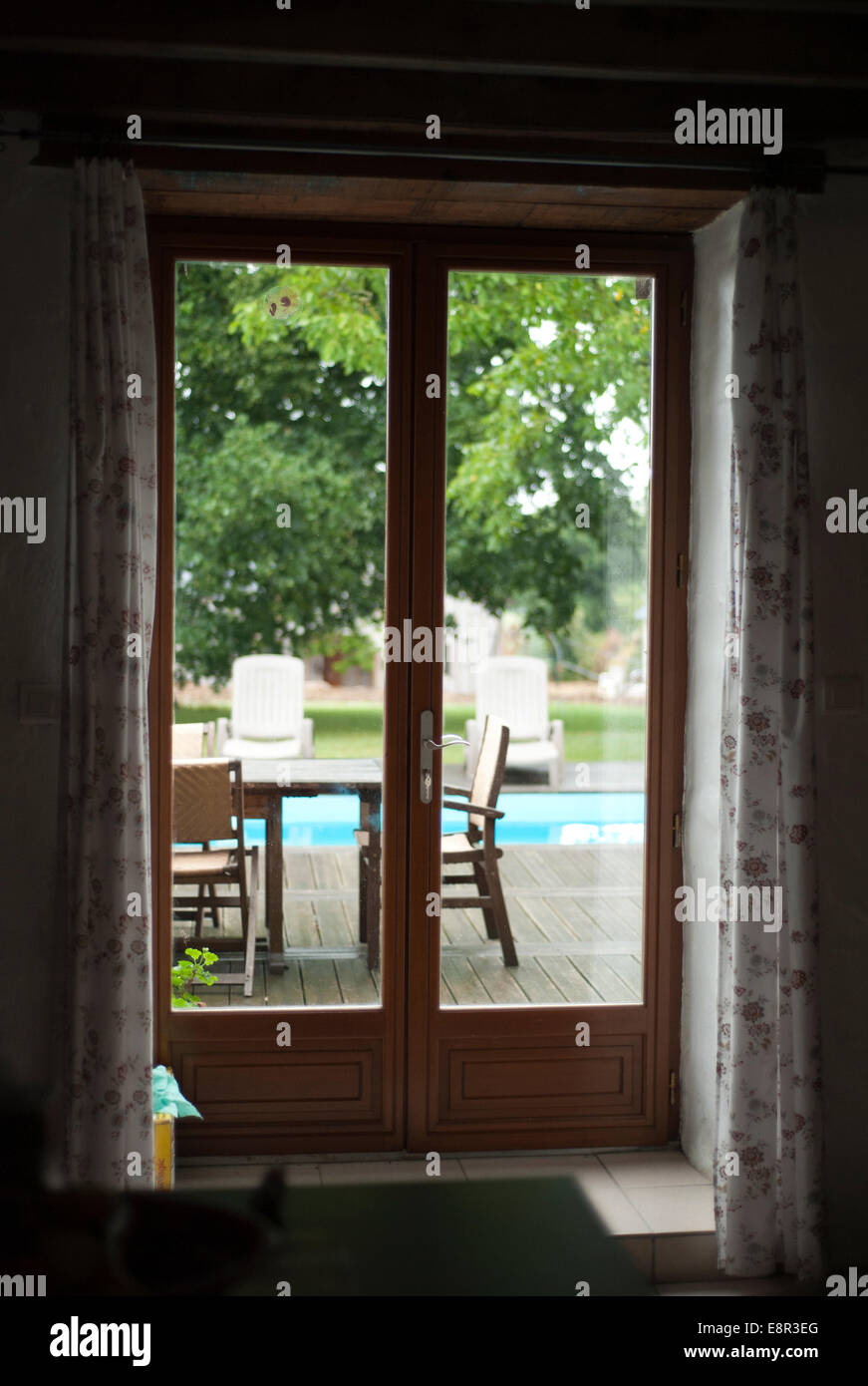 Looking Through The French Doors Of A French Holiday Cottage Into