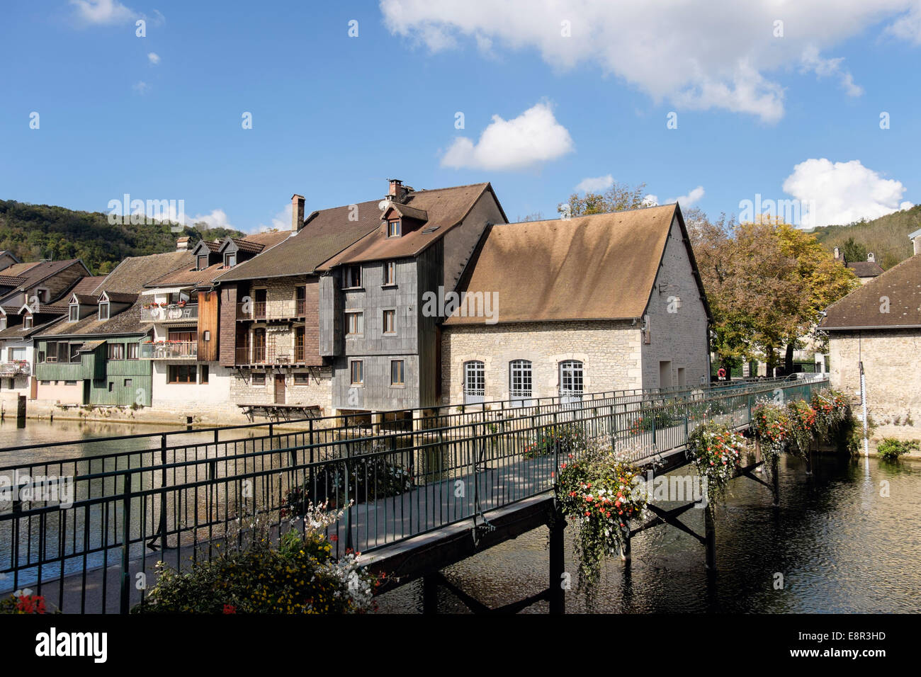 River Loue footbridge and quaint old houses in Ornans, Doubs, Franche Comte, France, Europe Stock Photo