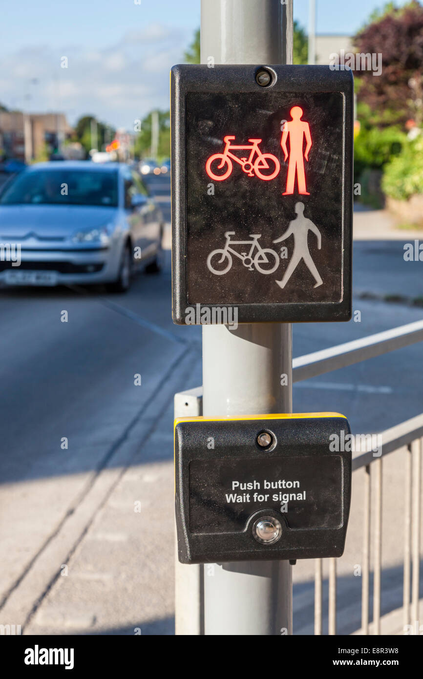 Toucan pedestrian crossing with the sign at red with a car approaching, Nottinghamshire, England, UK Stock Photo