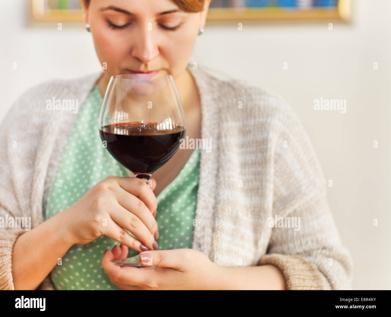 Closeup portrait of young woman drinking red wine with eyes closed ...