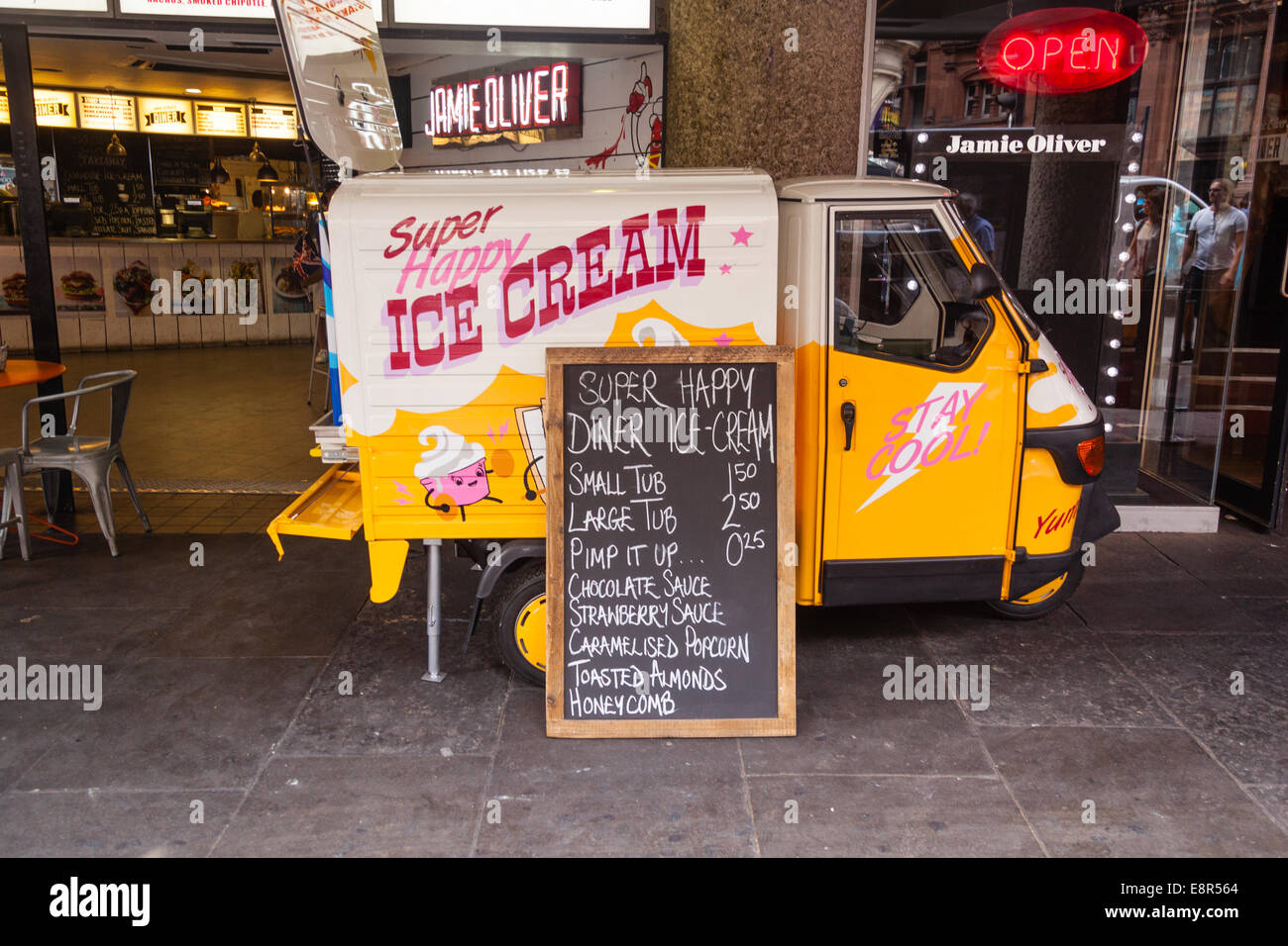 Vespa Piaggio ape ice cream truck, Shaftesbury avenue, London, England, United Kingdom. Stock Photo