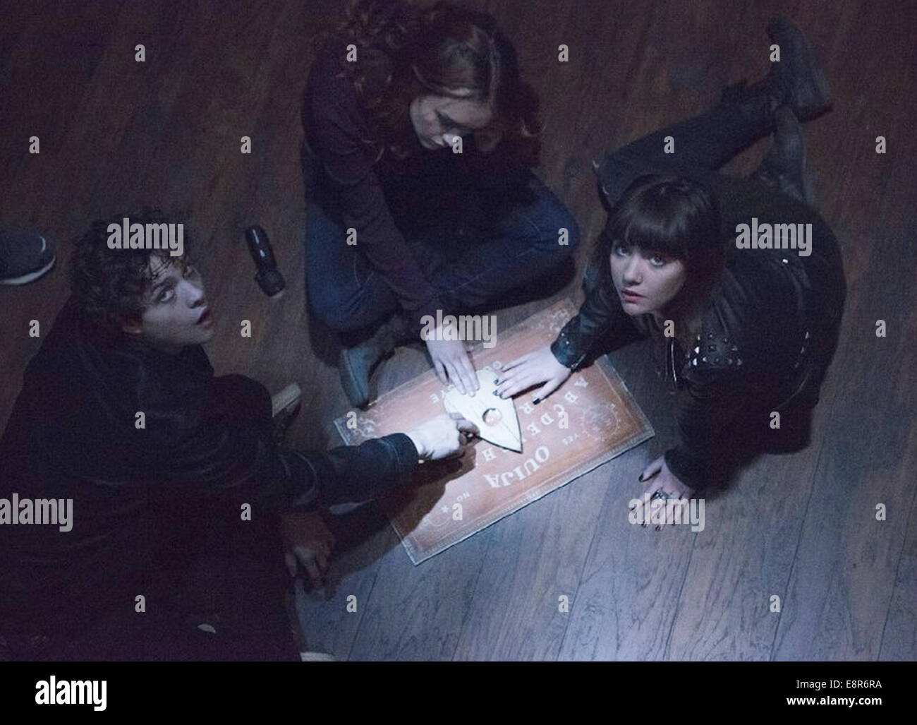 OUIJA 2014 Universal Pictures film with from left Douglas Smith, Ana Coto and Olivia Cooke Stock Photo
