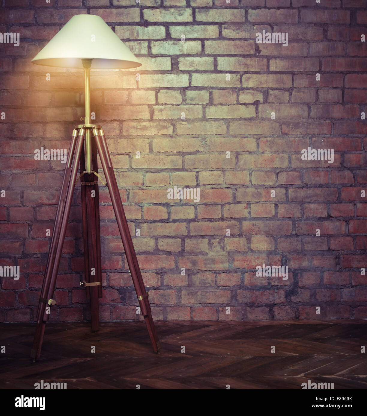 Picture of Interior of loft with retro lamp over brick wall Stock Photo - Alamy