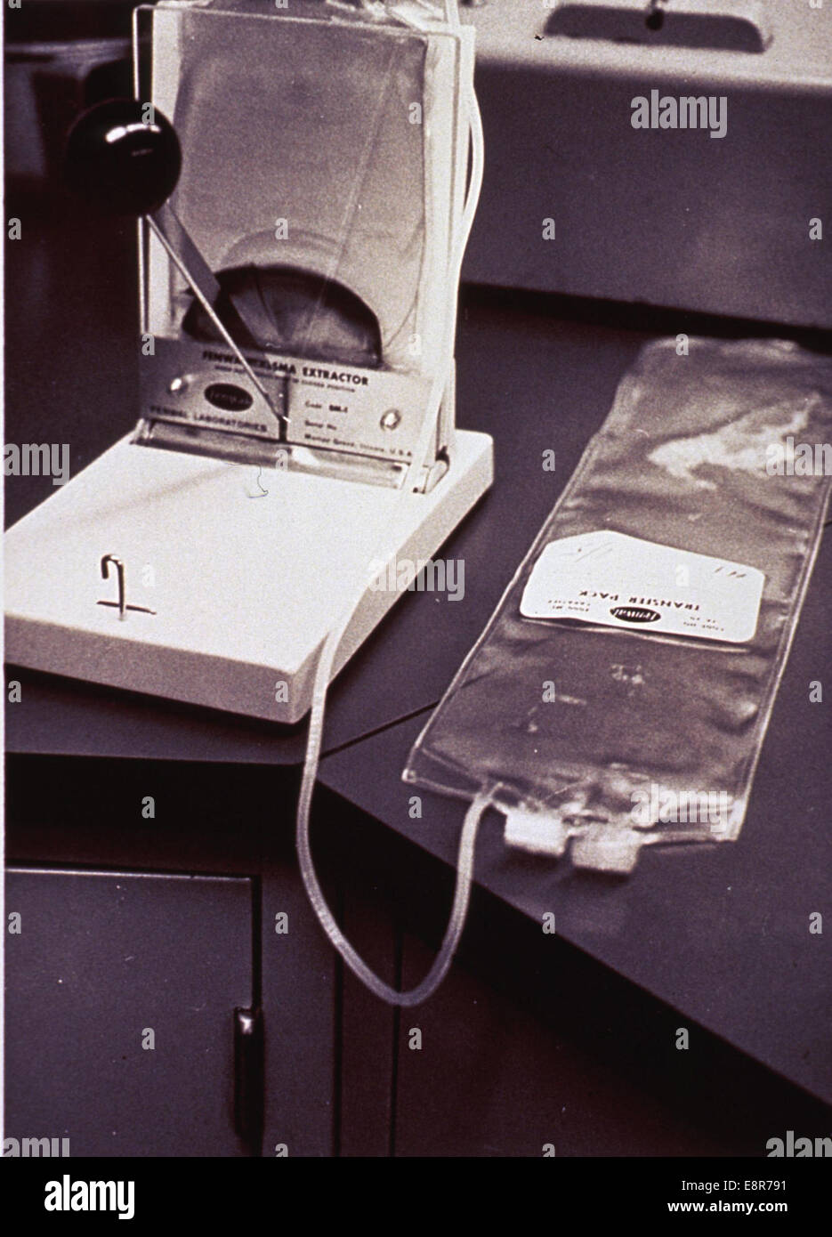 Photograph of a plasma transfer pack and extractor apparatus, created by Roy Perry. The image highlights the technical and medical equipment. Stock Photo