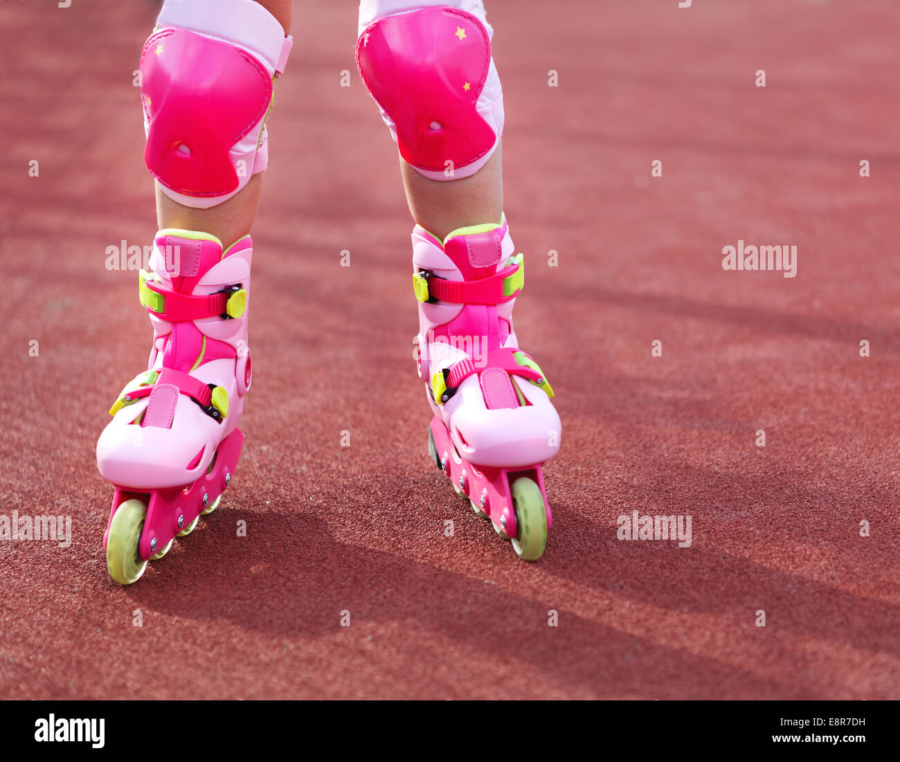 Rollerblades inline skates of a child closeup in action outdoors in