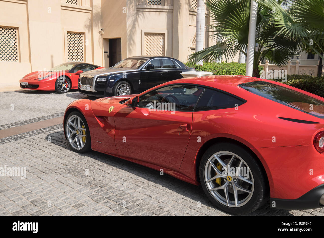 Luxury cars parked outside 5-star hotel in Dubai United Arab Emirates Stock Photo