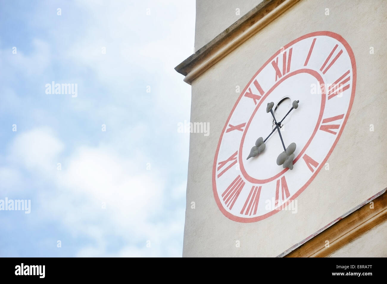 Architecture detail with old church clock tower and blue sky on background Stock Photo