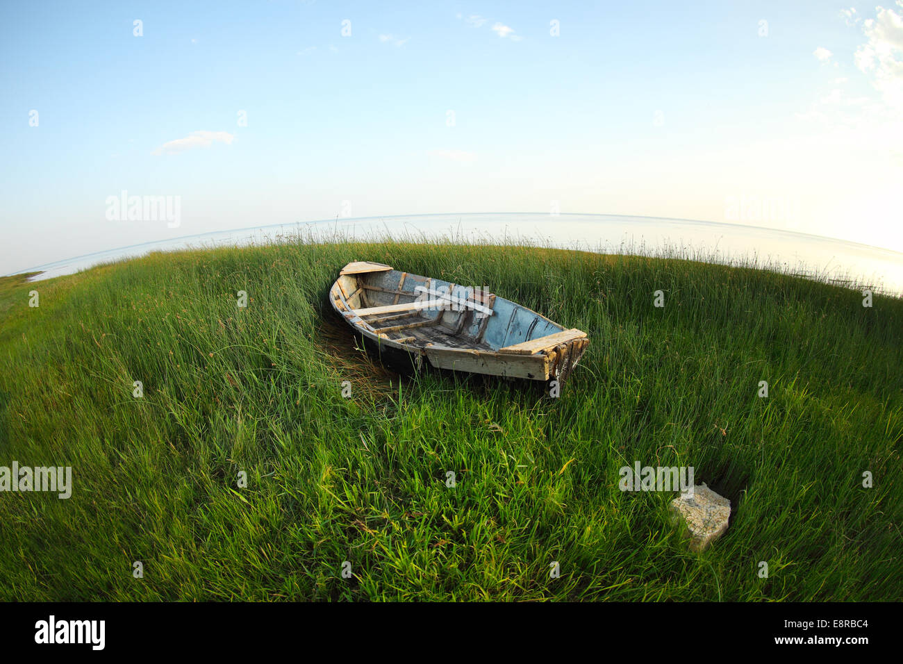 Old wooden fishing boat on the green grass near the sea Stock Photo - Alamy