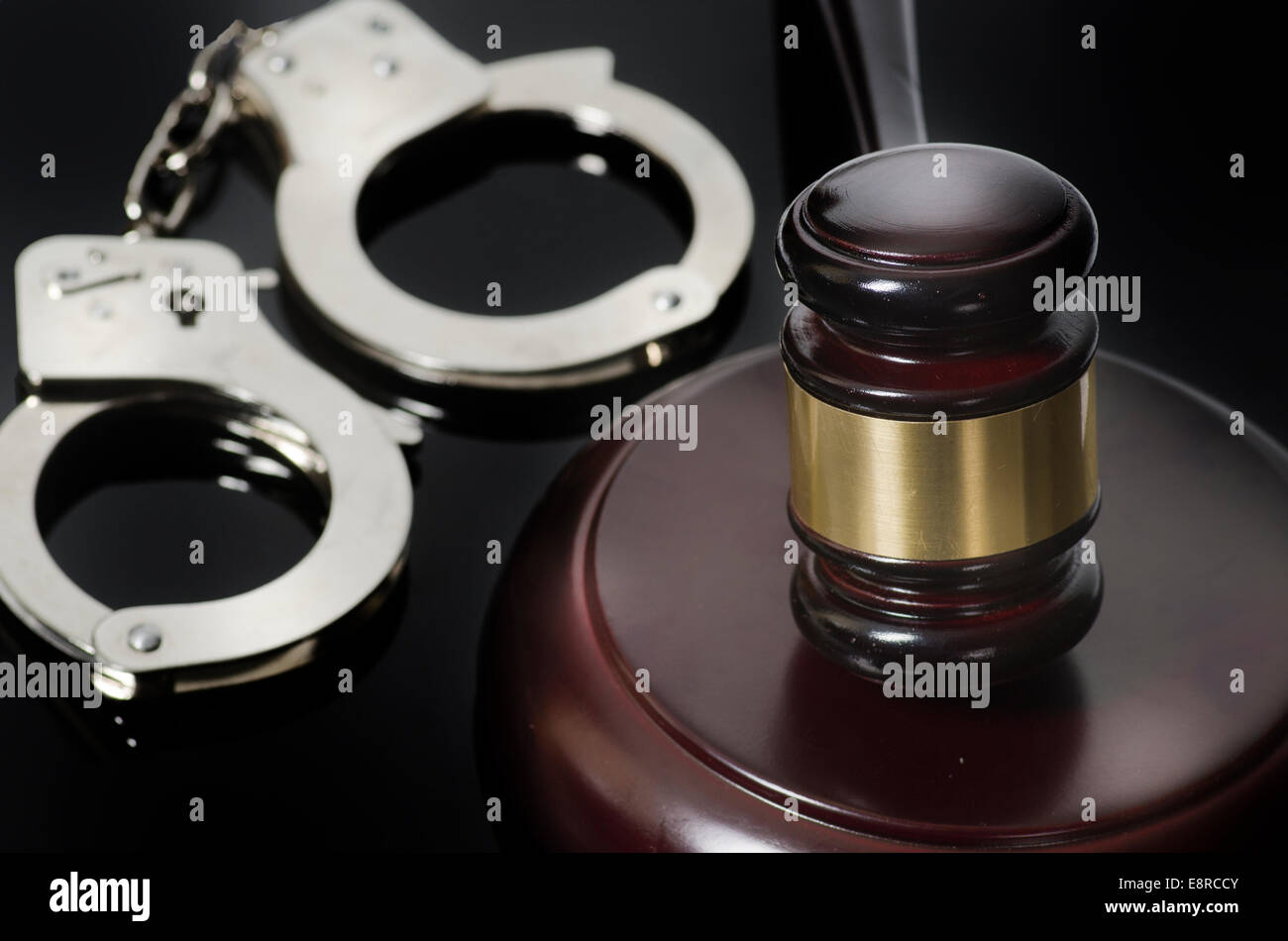 Legal law concept image. Handcuffs gavel and law books Stock Photo Alamy