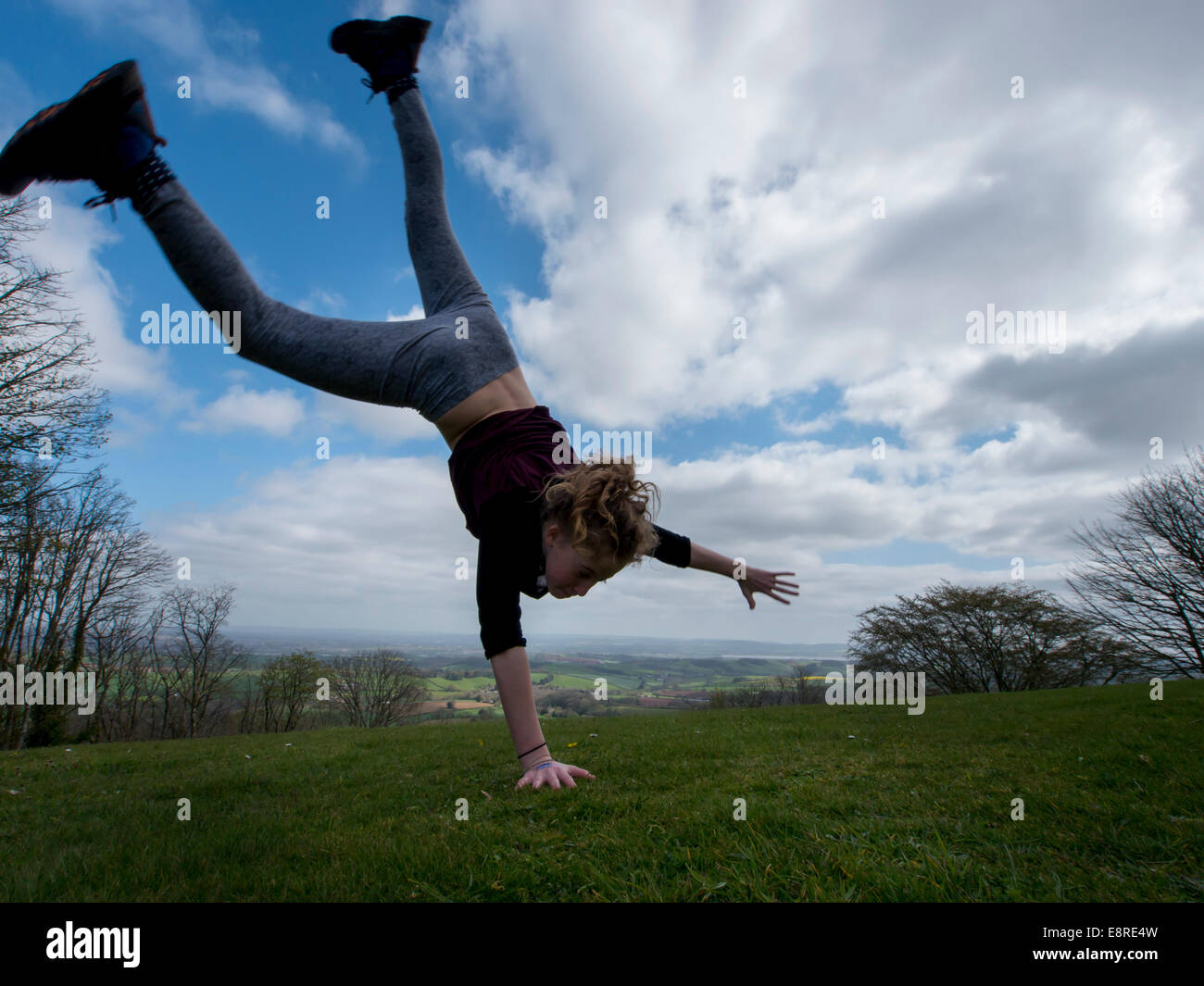 Girl cartwheel Stock Photo