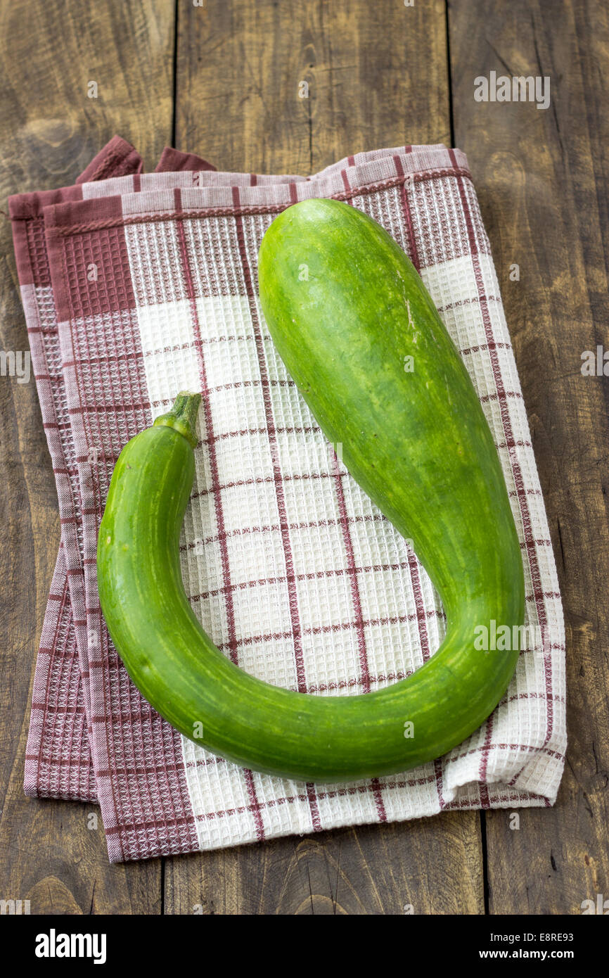 big zucchini squash on wooden table, from above Stock Photo Alamy