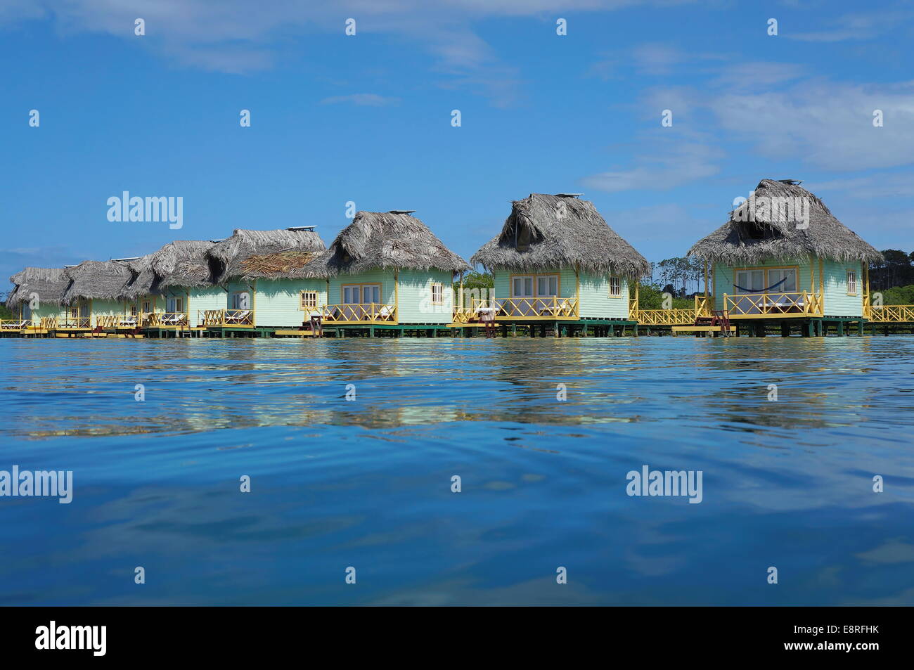 Over water bungalows with thatch roof in the Caribbean sea, Central America, Panama Stock Photo