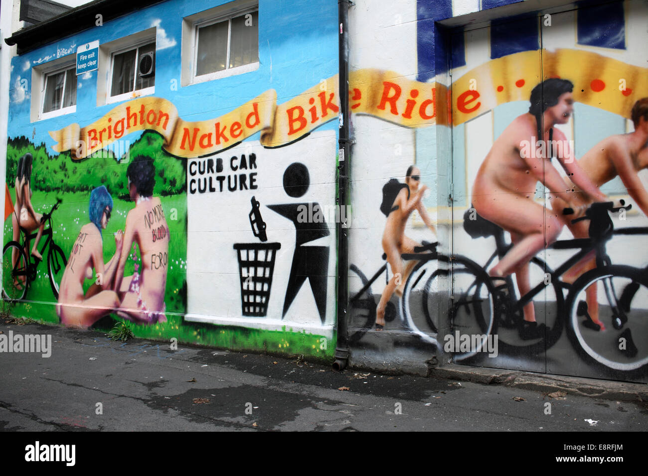 Part of a mural depicting the annual Brighton Naked Bike Ride, including the slogan “CURB CAR CULTURE”, Brighton. Stock Photo