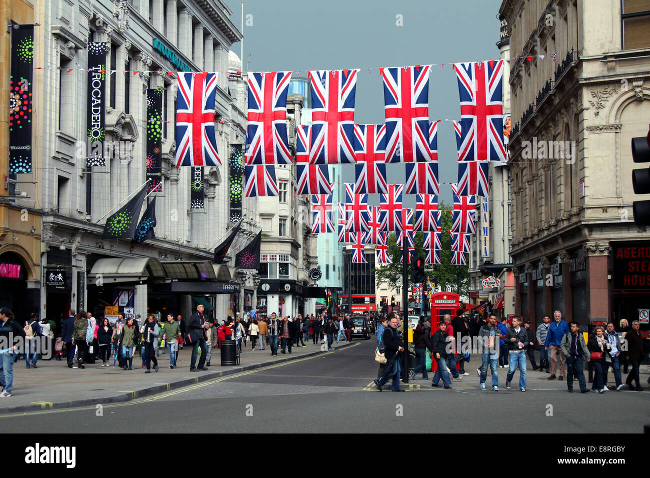 Union flags flying between buildings in Coventry Street, central London, on 15th May, 2012. Stock Photo