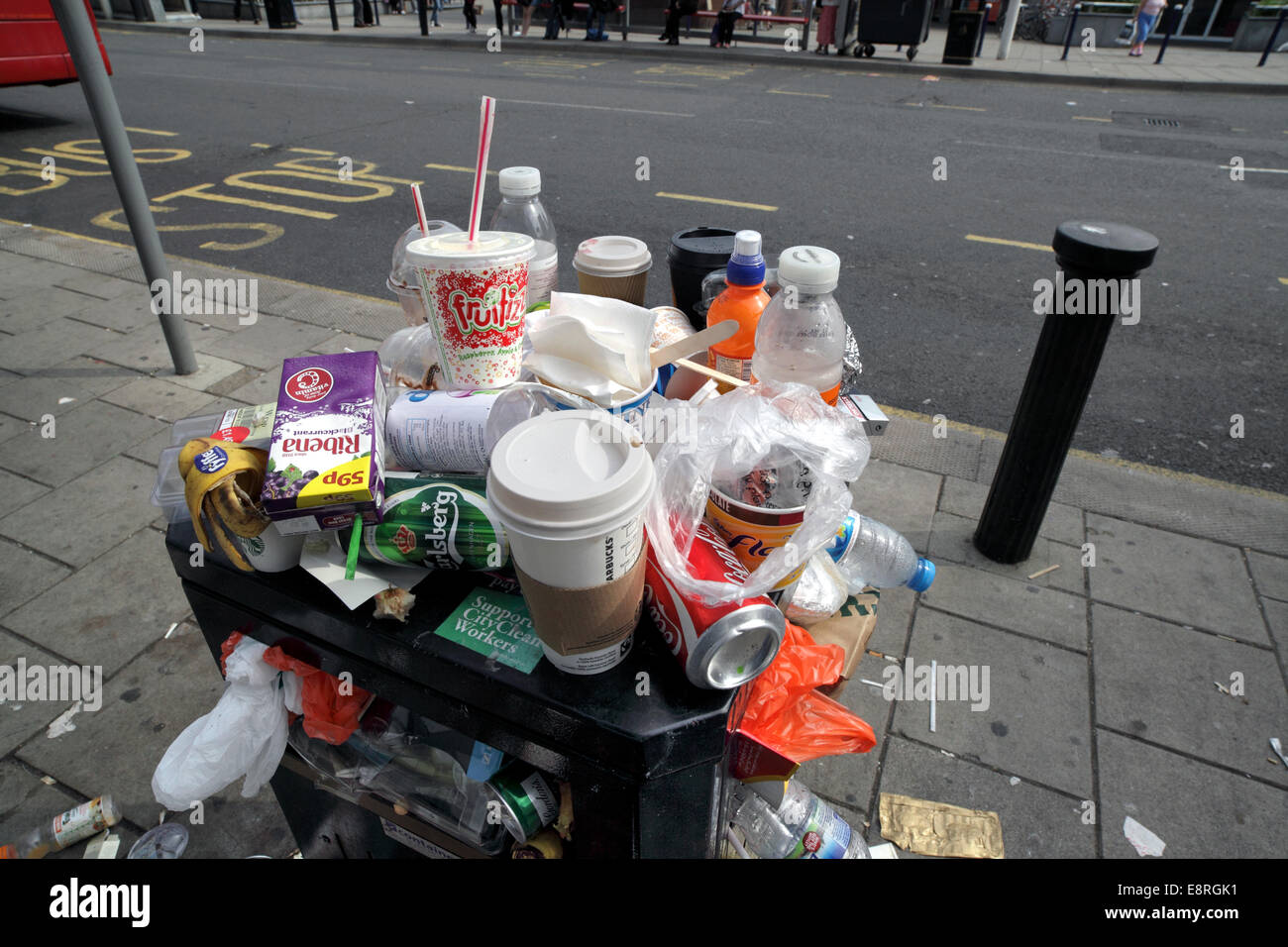 Overflowing litter bin in Brighton city centre. Stock Photo