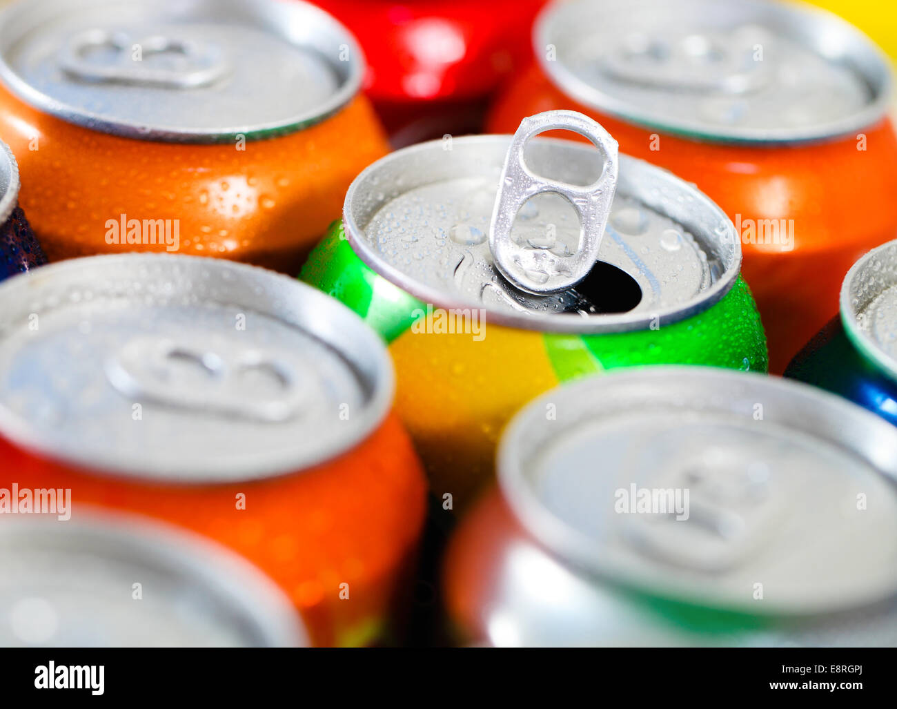 Cans of sweet drinks (or beer). Cooling frozen and with water drops Stock Photo