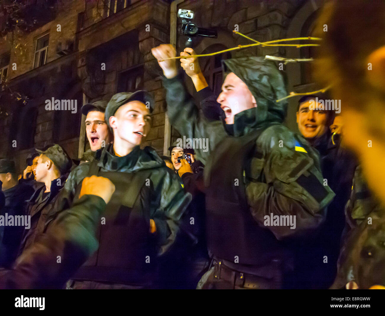 Kiev, Ukraine. 13th Oct, 2014. National Guard soldiers chanting: 'Demobilization' -- About 500 National Guard conscripts picketed the Presidential Administration of Ukraine. They demanded the demobilization, have served more than the statutory period. By protesting soldiers came fighters wounded in eastern Ukraine. They announced the demonstrators traitors and deserters. Credit:  Igor Golovnov/Alamy Live News Stock Photo