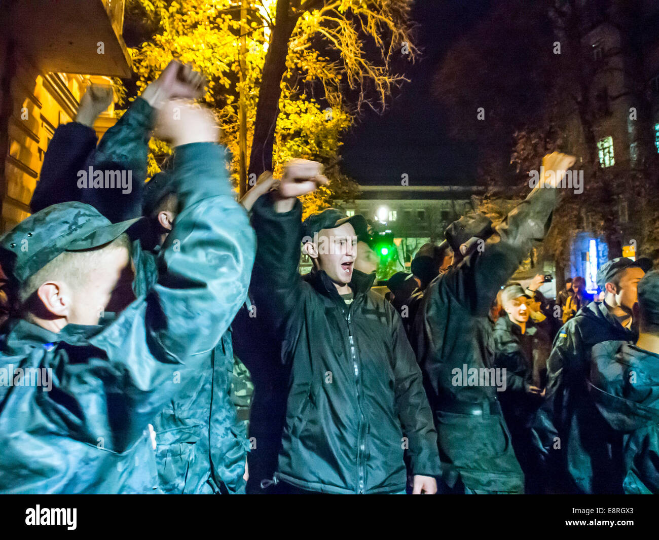 Kiev, Ukraine. 13th Oct, 2014. National Guard soldiers chanting: 'Demobilization' -- About 500 National Guard conscripts picketed the Presidential Administration of Ukraine. They demanded the demobilization, have served more than the statutory period. By protesting soldiers came fighters wounded in eastern Ukraine. They announced the demonstrators traitors and deserters. Credit:  Igor Golovnov/Alamy Live News Stock Photo