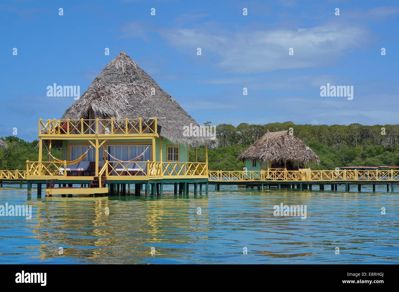 Over water bungalow with thatched roof, Caribbean sea, Bocas del Toro
