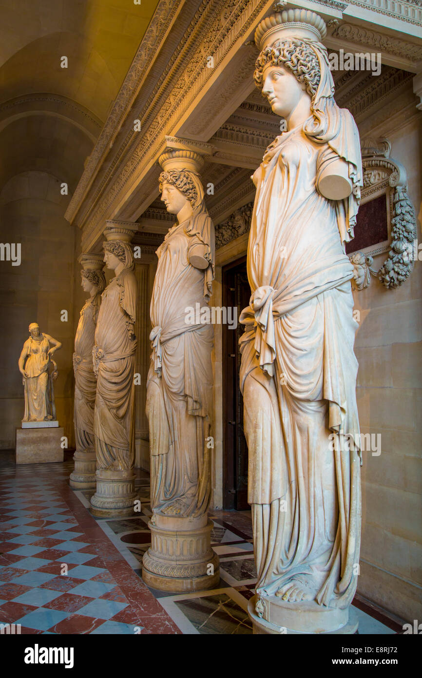Sculpted Caryatids line one end of the Caryatids Hall in Musee du Louvre, Paris, France Stock Photo