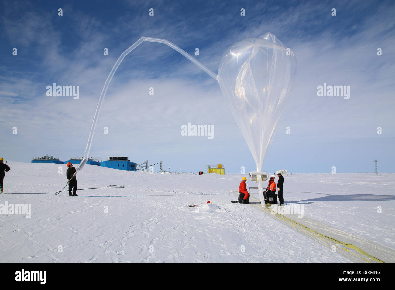 The BARREL team at Halley Research Station in Antarctica, work to inflate a balloon.  The long tube on the left is the inflation Stock Photo
