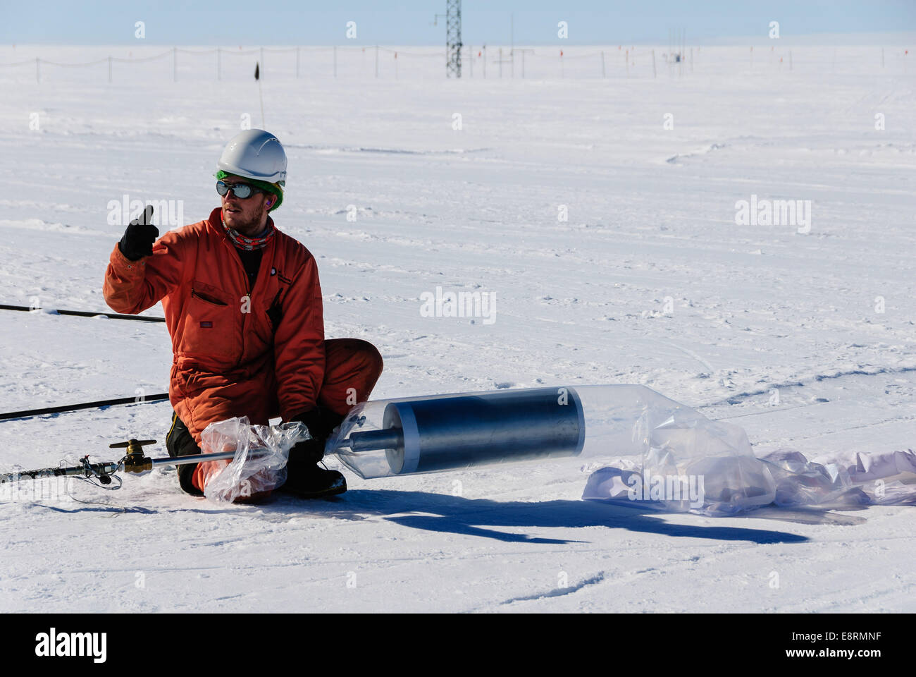 The Halley station team members assisted the BARREL team with the launches. Here, one gives the thumbs up to start inflating a B Stock Photo
