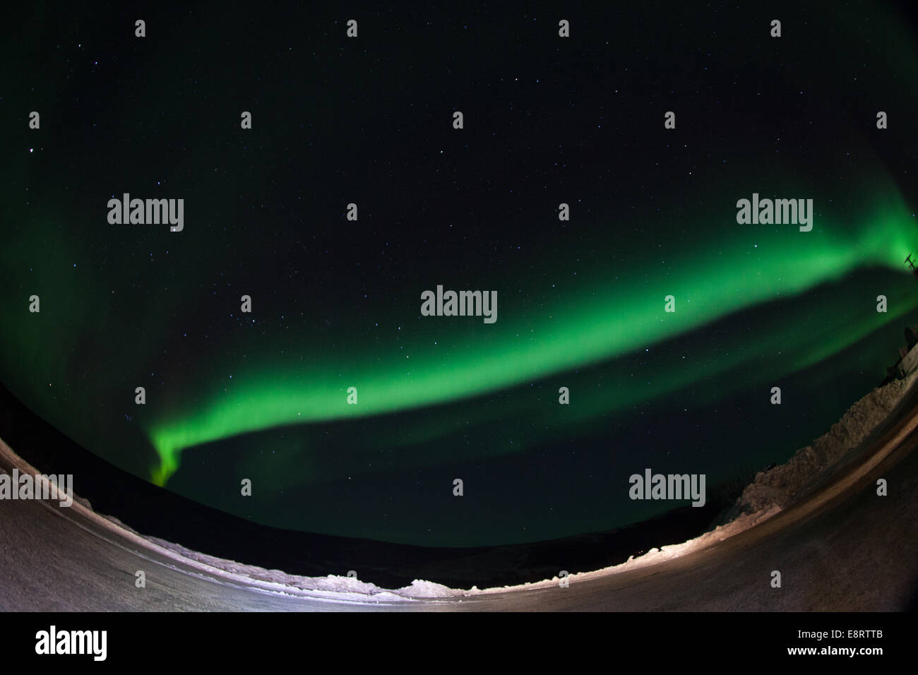 Caption: A NASA-funded sounding rocket launches into an aurora in the early morning of March 3, 2014, over Venetie, Alaska. The Stock Photo