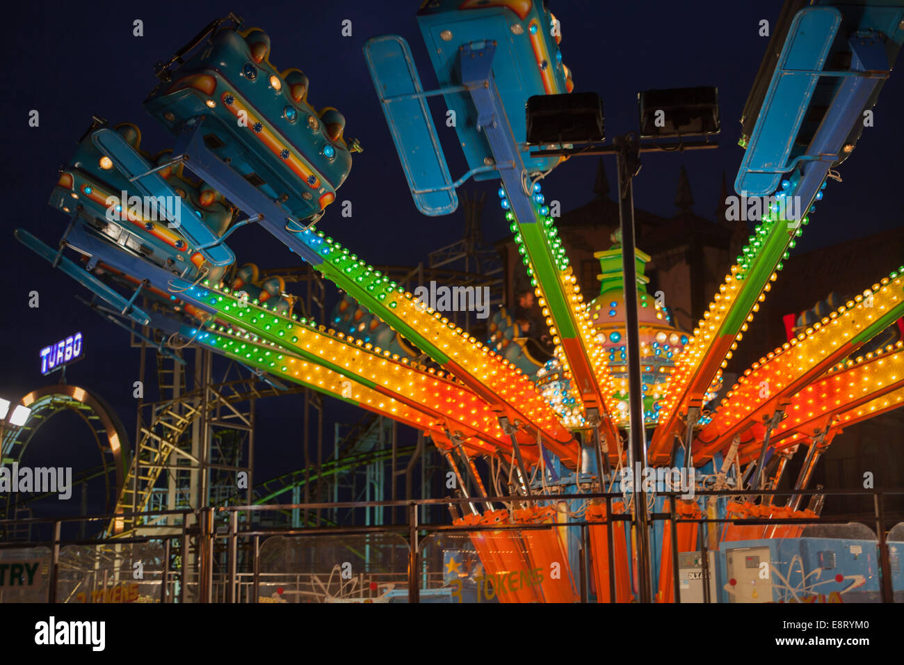 The Brighton Pier fairground at night. Stock Photo