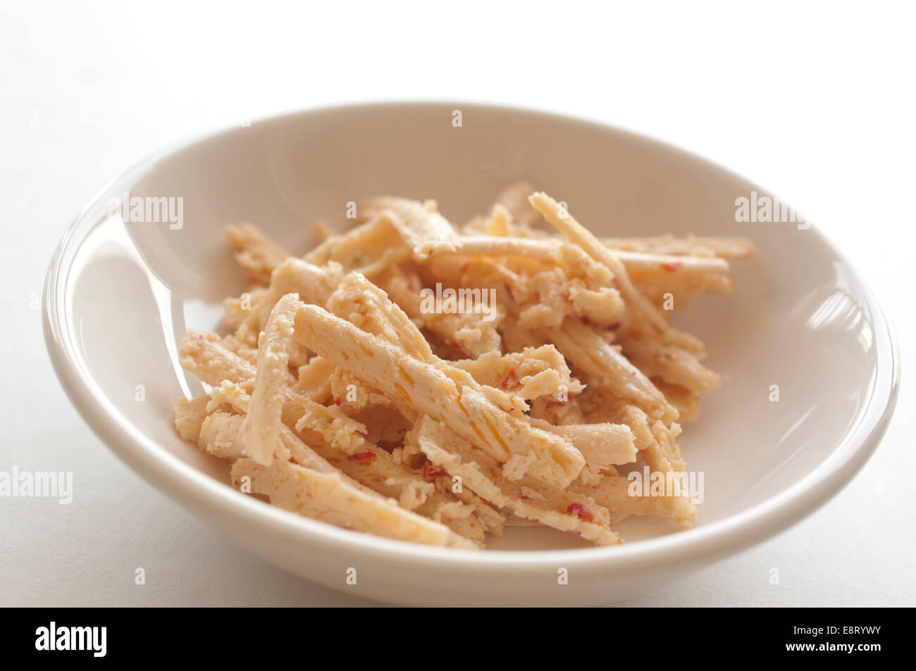 White bowl of grated cheese Stock Photo