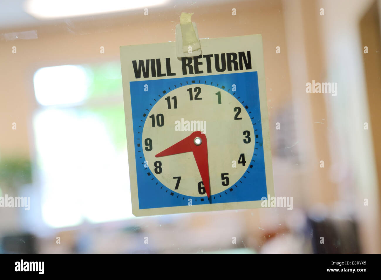 Will return sign with office background Stock Photo