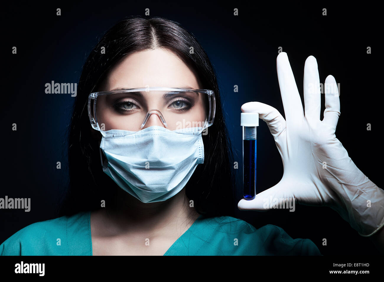 Attractive Scientist Holding Tube In Dark Stock Photo Alamy attractive-scientist-holding-tube-in-dark-stock-photo-alamy