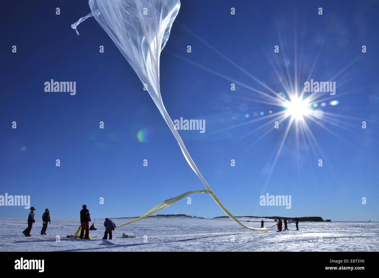 Some of the BARREL balloon launches took place at the South African National Antarctic Expedition Research base, called SANAE IV, the others at Halley Research Station. This balloon is taking flight at SANAE IV. Stock Photo